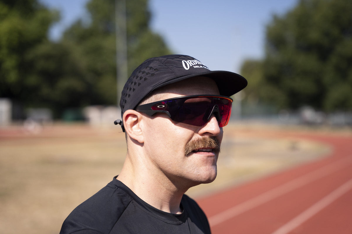 Ordinary Mile Club runner on a track training for a parkrun personal best